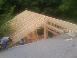 Framing a new roof addition that ties into an existing shingle roof in Herman